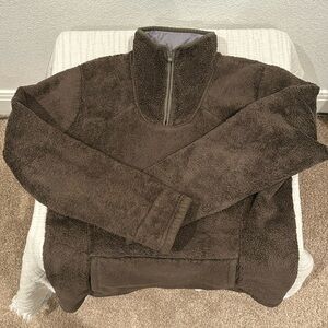 The North Face women’s pullover olive/brown sweater in size medium.